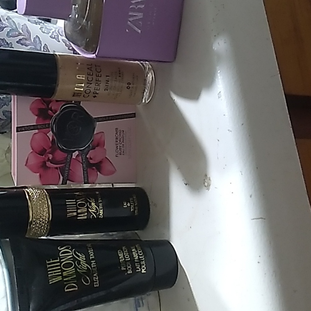 Mixture of perfumes and one milani foundation